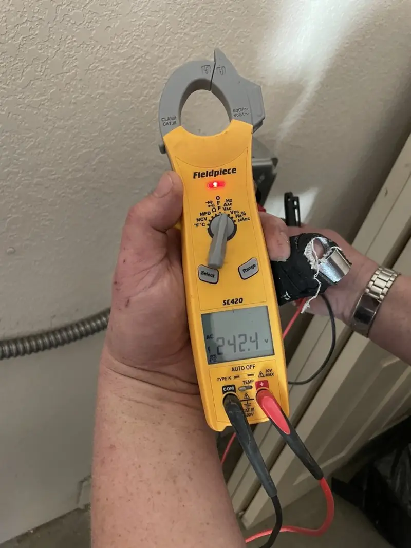 Voltage testing with clamp meter during Electrical Installation Services in Wrightstown